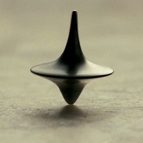 A script outline might end with a closing image like this (the spinning-top dream totem from INCEPTION